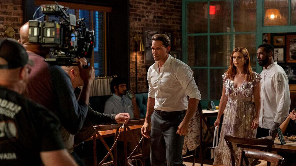Justin Bruening as Cal Maddox, Joanna Garcia Swisher as Maddie Townsend, Dion Johnston as Erik Whitley. Cr. Steve Swisher/Netflix © 2022