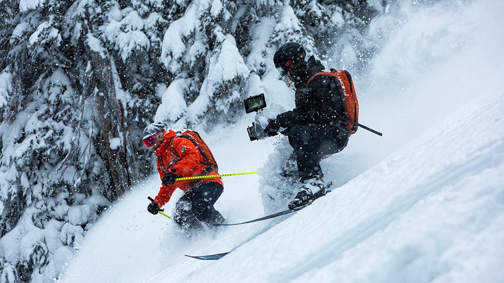 Mark Ambin skiing while being filmed in the film Dreaming of a Better Place