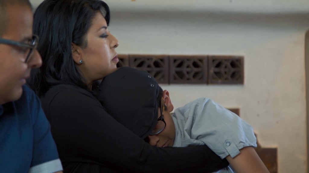 Scene of family comforting young boy in This Hits Home Documentary shot with Pocket Cinema Camera 6K G2