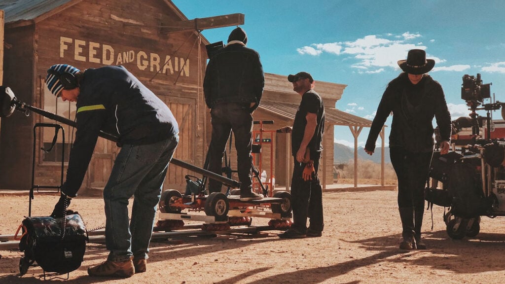 Dusty western movie set with camera equipment