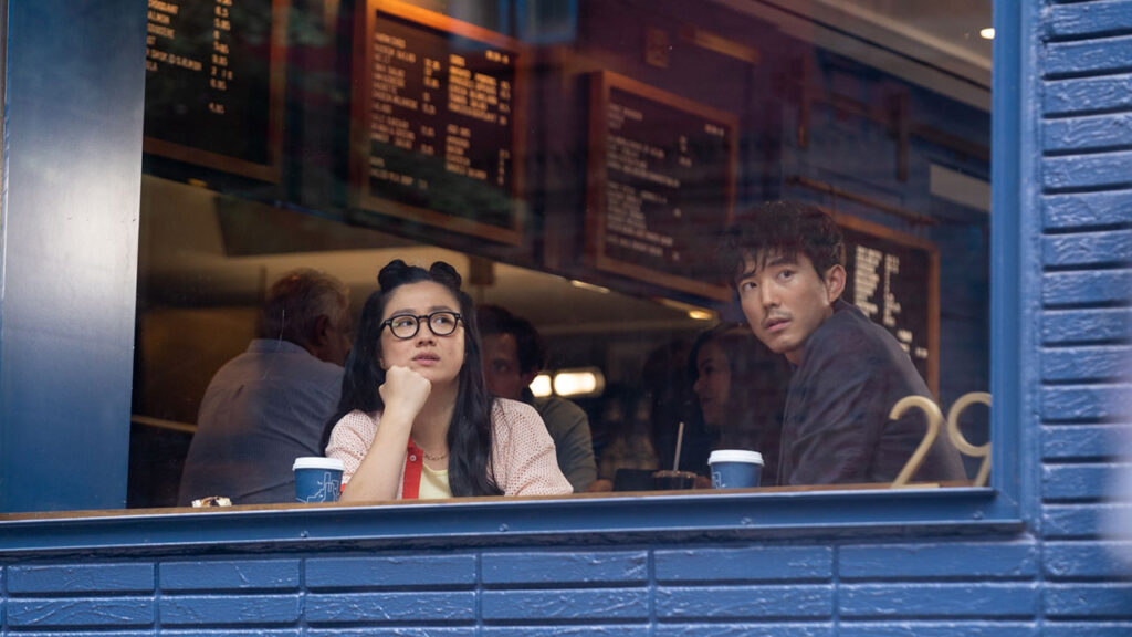 Scene of two people looking out of coffee shop window from Shortcomings courtesy Sony Pictures