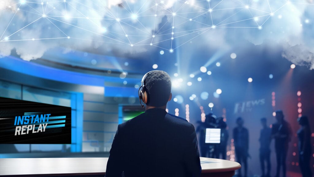 A man sits in a broadcast news studio