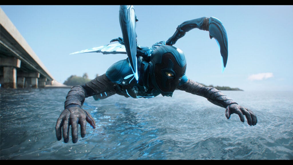 Blue Beetle flies over water with VFX created by Digital Domain