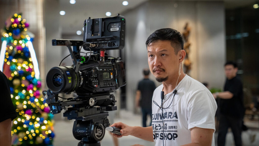 Eric Wong operates a Blackmagic camera while shooting his film Hi Noel