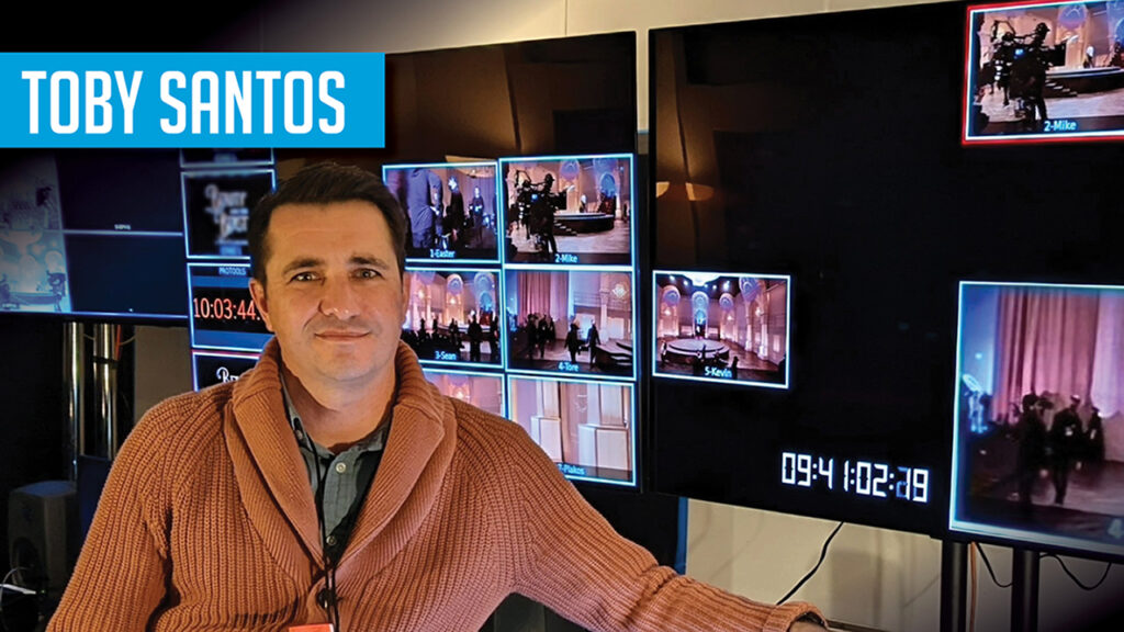 Toby Santos sits in his live production studio with monitors in the background