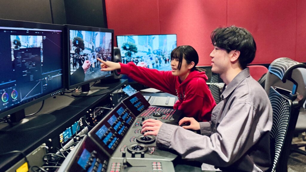 Two students use broadcasting equipment built by Blackmagic Design