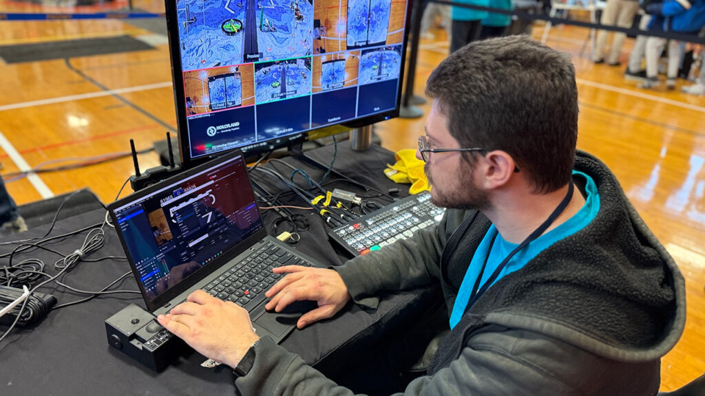 A man uses a Blackmagic ATEM Live Production Switcher at the Long Island STEM Competition and Tech Challenges