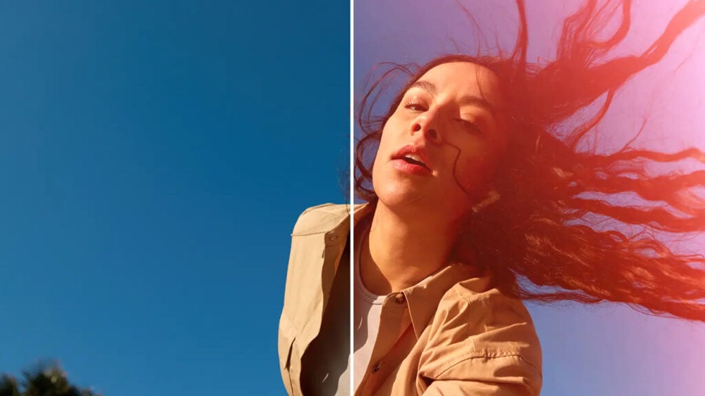 screenshot of a woman with her hair blowing out behind her