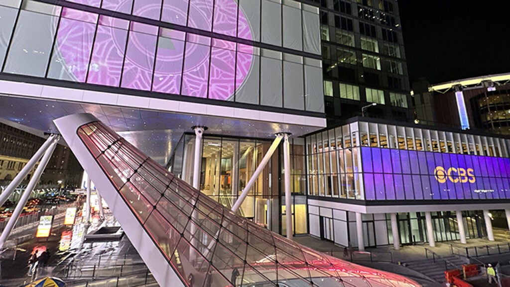 a building with many lights lit up in the windows