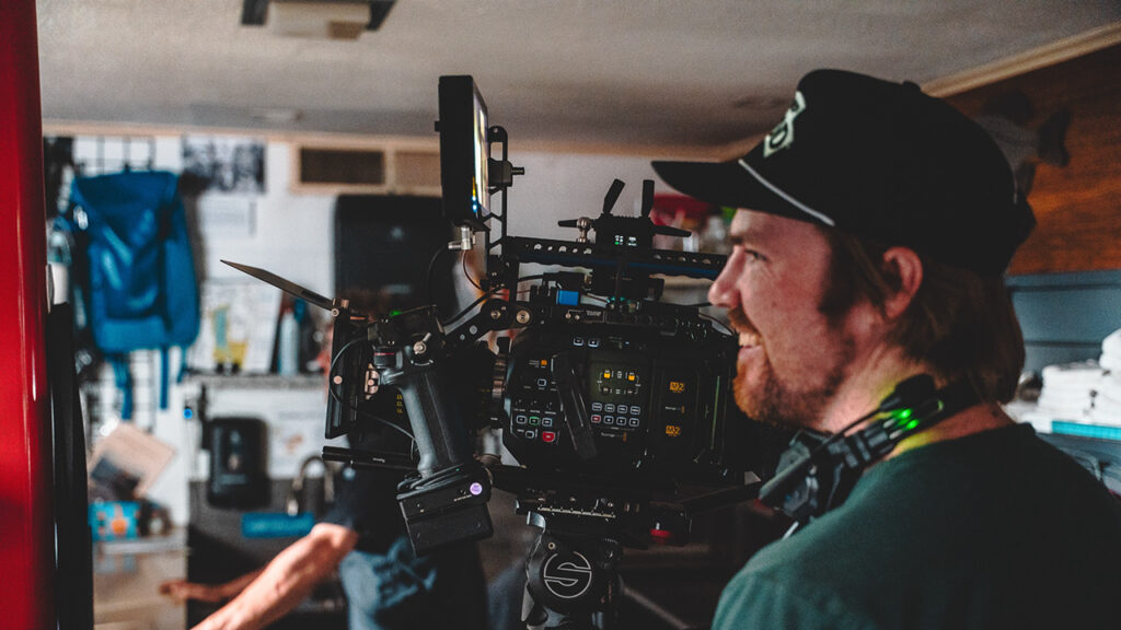 A man works the camera while filming the movie Dead Girl Summer