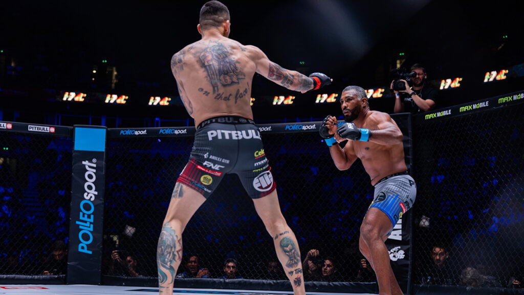 two MMA fighters face off in an arena