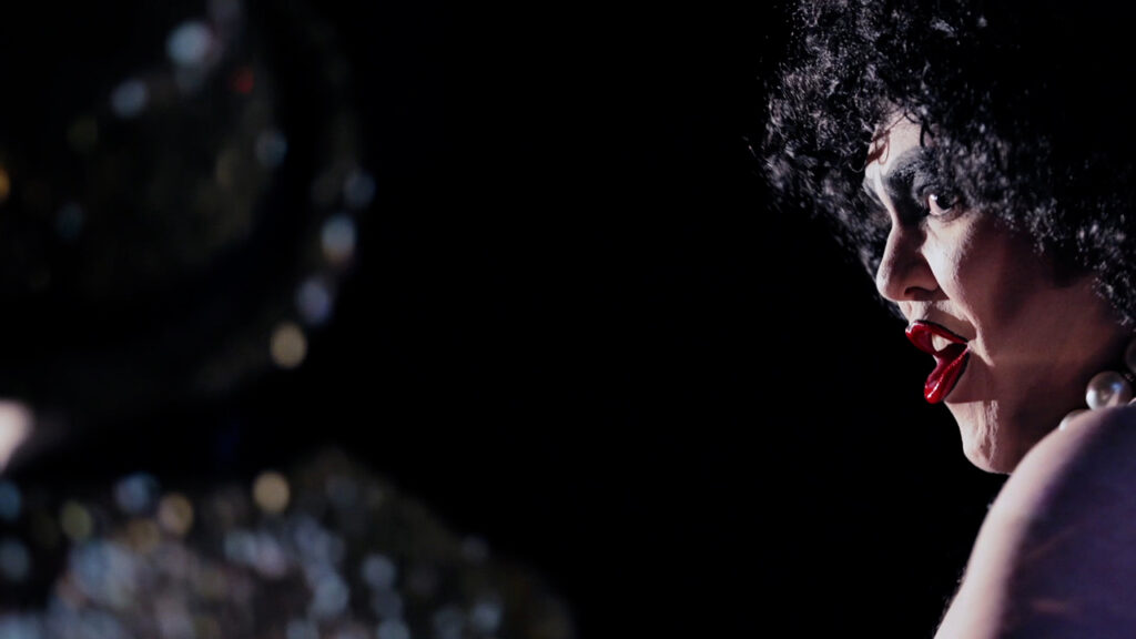 a person sings in The Rocky Horror Picture Show