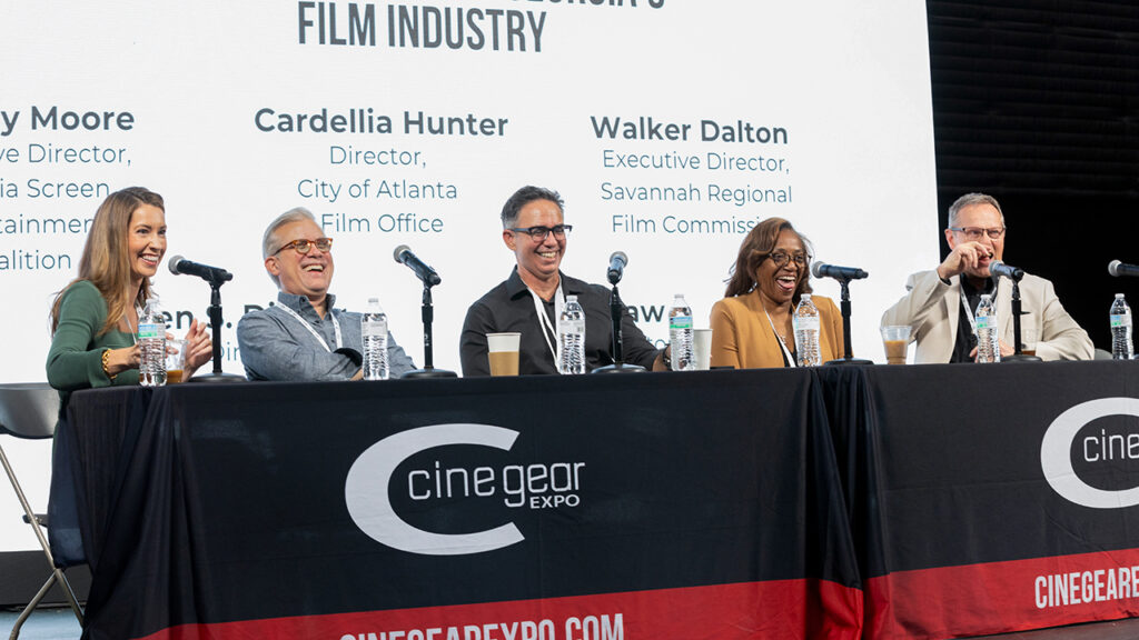 A woman interviews two people at the Cine Gear Expo in Atlanta 2025