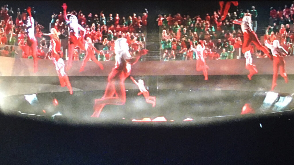 Acrobats perform wearing red in an arena in the movie Logan's Run courtesy MGM