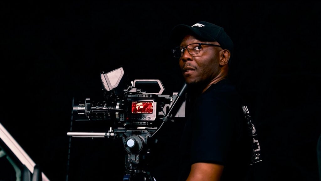 a man runs a Blackmagic camera