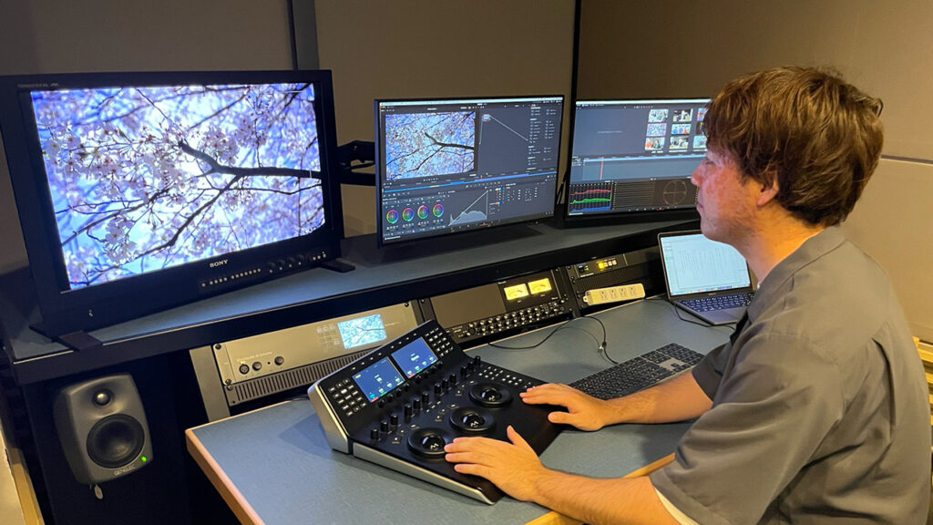 a man works in a broadcasting studio using DaVinci Resolve Studio software