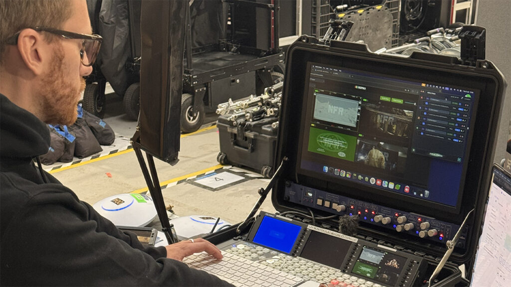 a man looks at a computer screen that displays Pusar RePro Stream encoder software