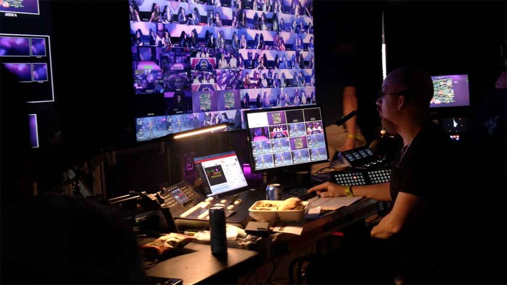 A man works in a studio during a live production