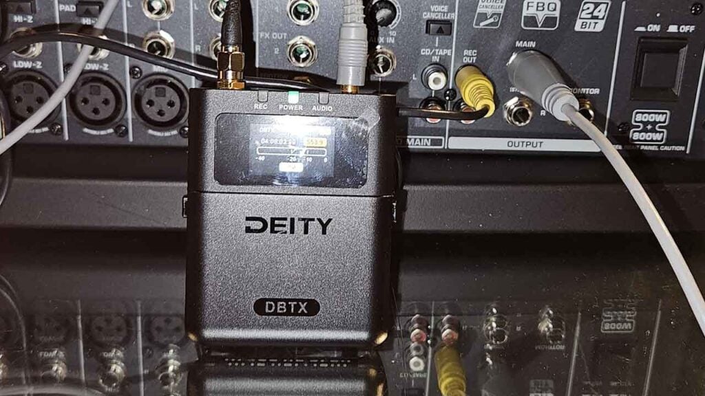 A Deity Theos Digital UHF Wireless microphone receiver connected to production equipment