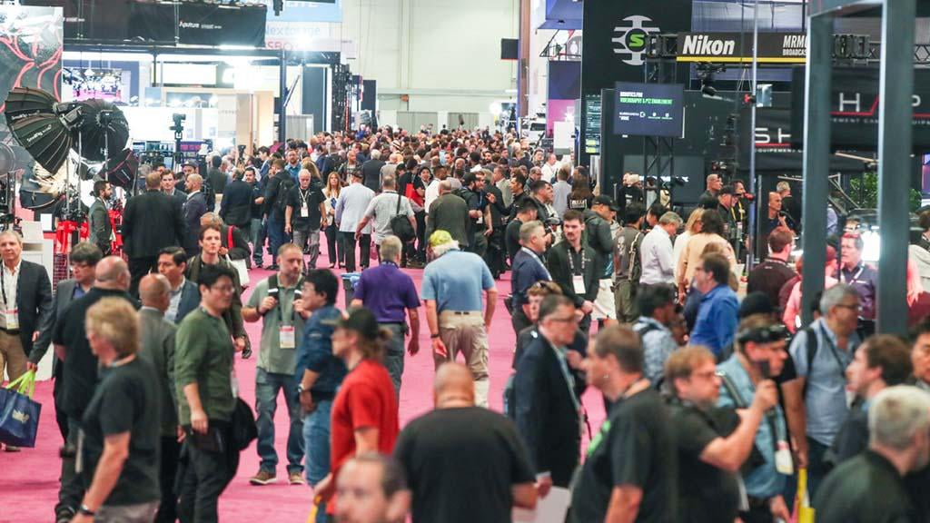 A crowd of people mill about the NAB show in Las Vegas