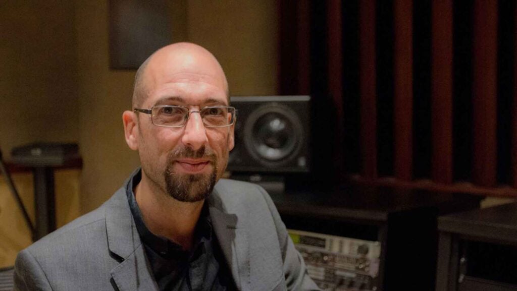 NUGEN CEO Paul Tapper sits in a sound studio