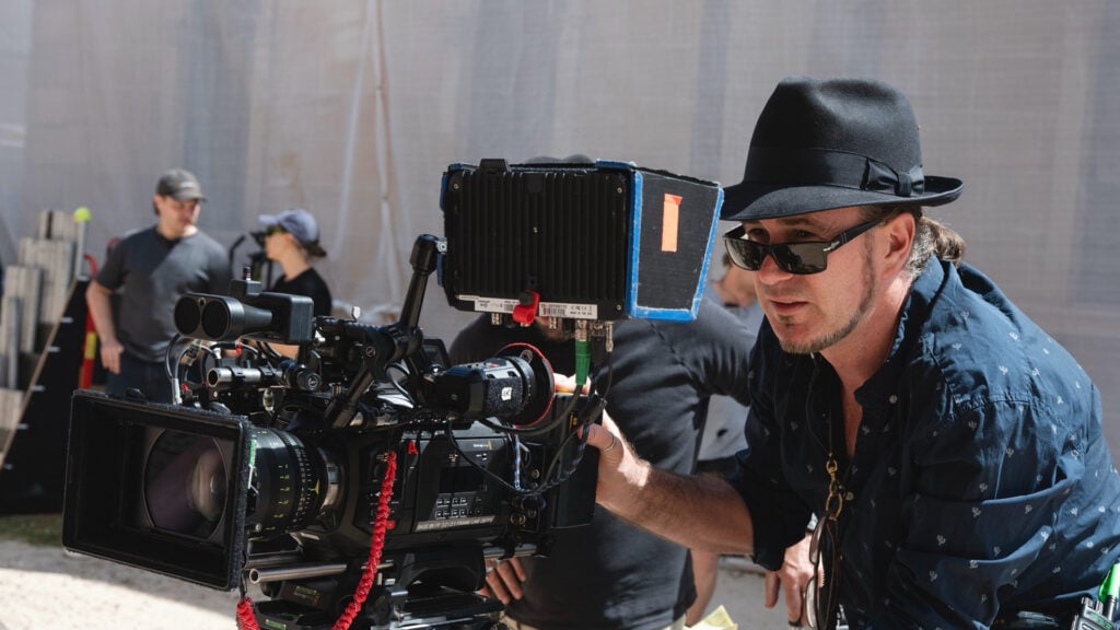 Judd Overton handles a Blackmagic camera on a set