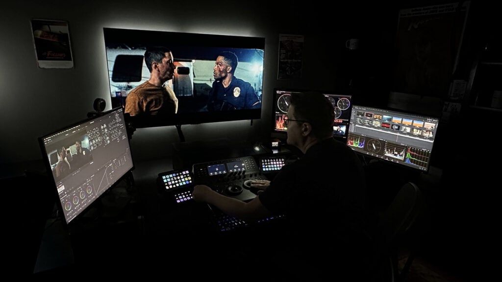 a man edits footage for the production Night Patrol using DaVinci Resolve Studio software