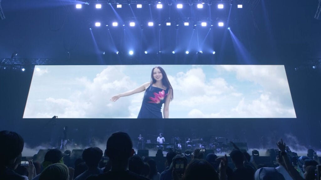 a woman appears on a giant screen at a concert where the Blackmagic URSA Cine 12K LF has been Used to Create Visuals for STUTS’ K-Arena Concert