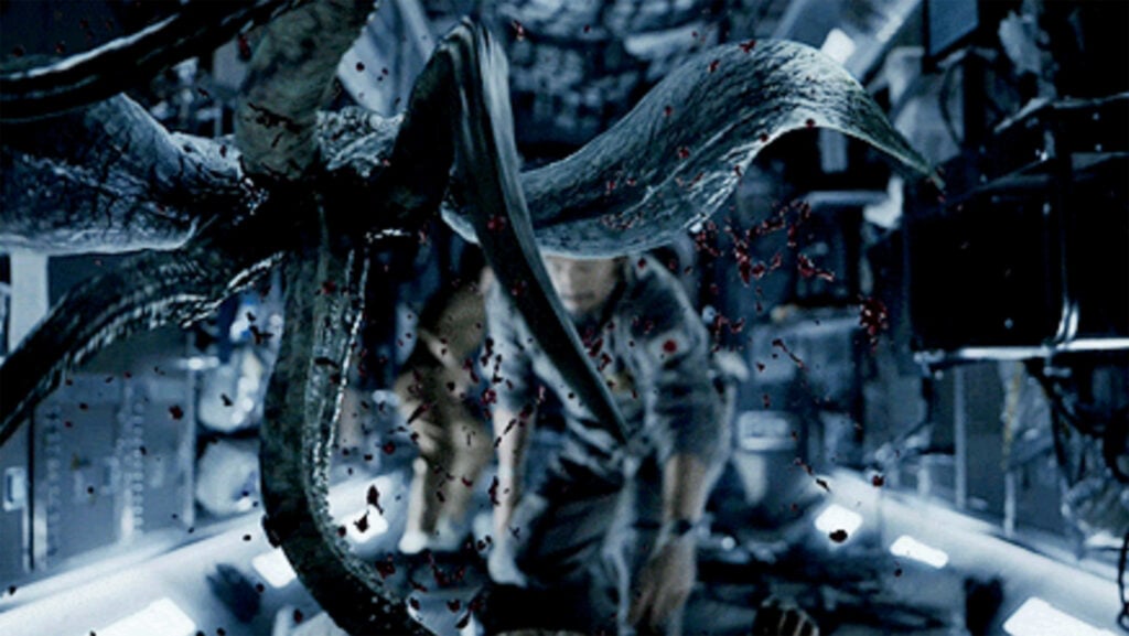 a screenshot from the movie Life where an extraterrestrial creature chases a man