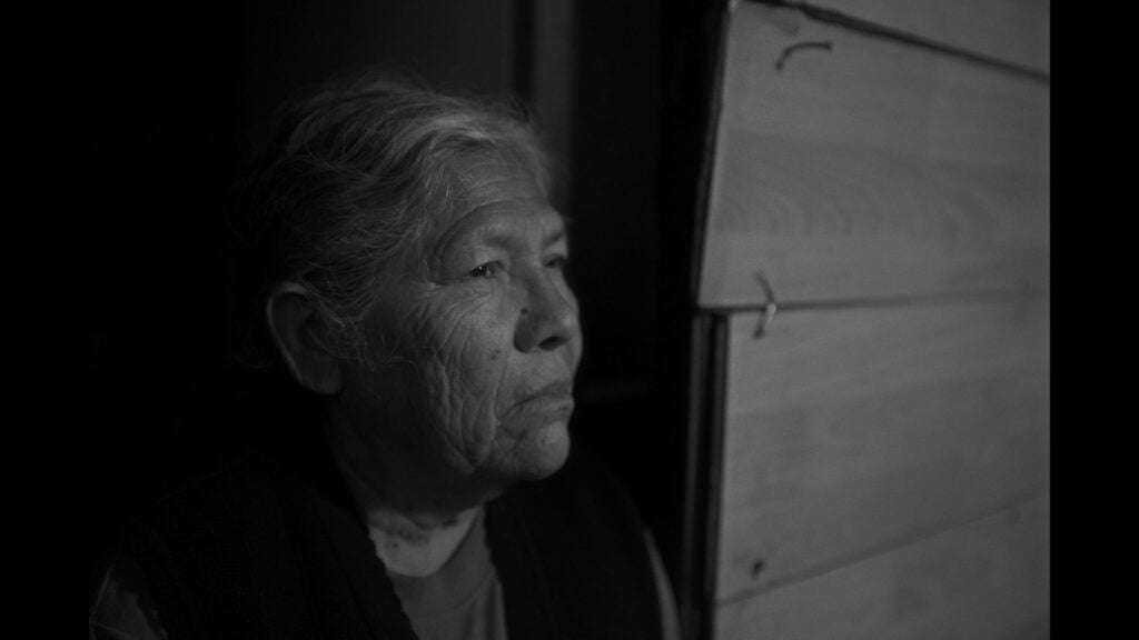 a woman stares off into the distance