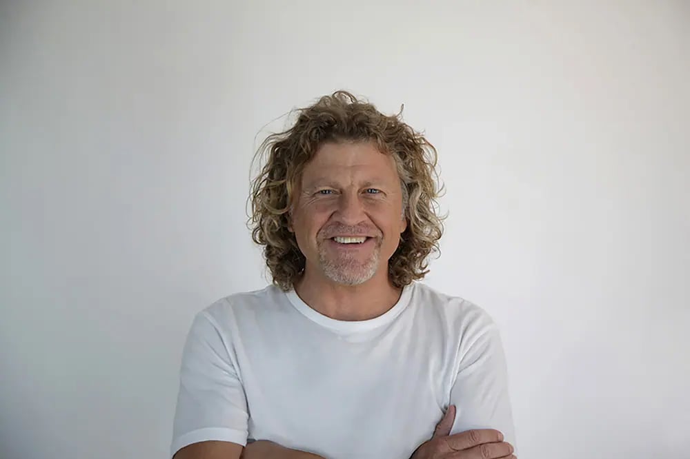 Patrick Davenport poses for a photo wearing a white t-shirt