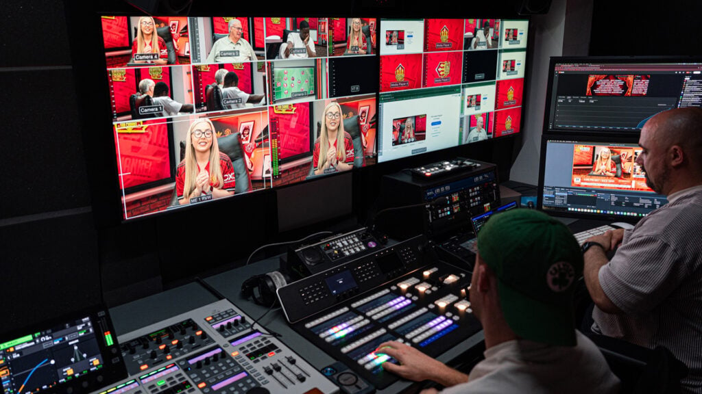 The broadcast production studio for The United Stand with multiple monitors and Blackmagic Design production equipment