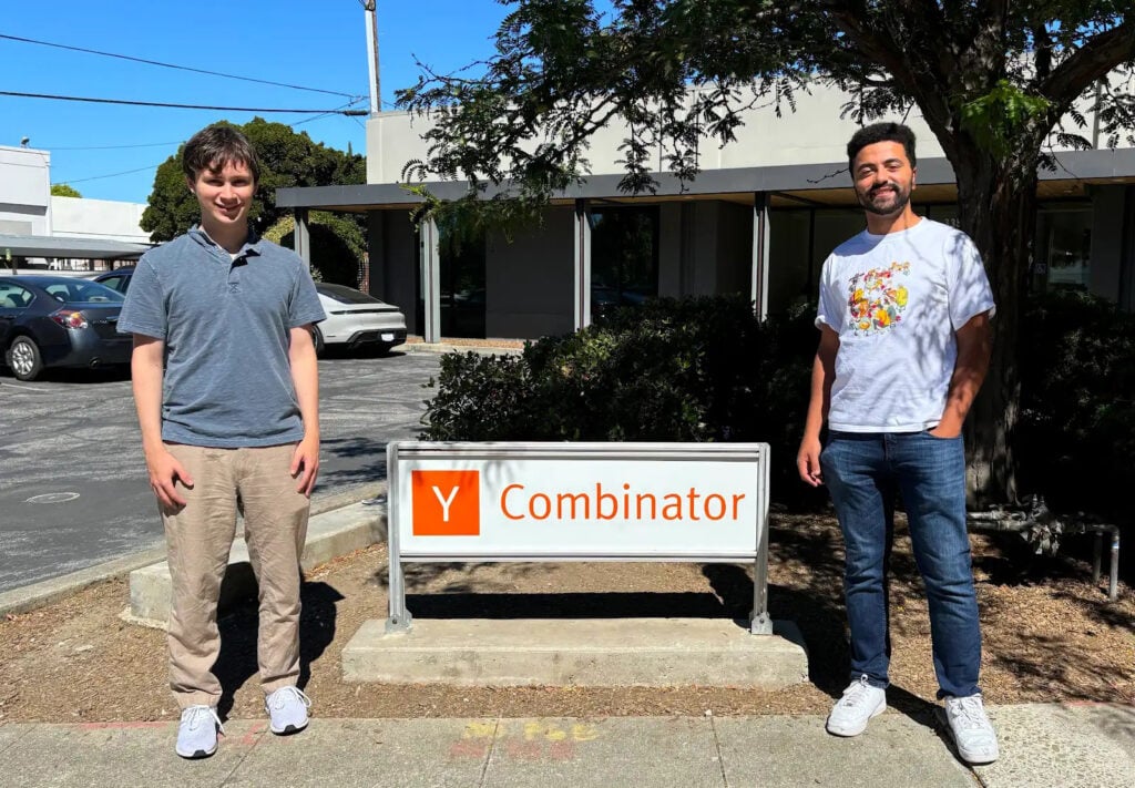 VideoGen co-founders Anton Koenig and David Grossman stand next to the Y Combinator sign